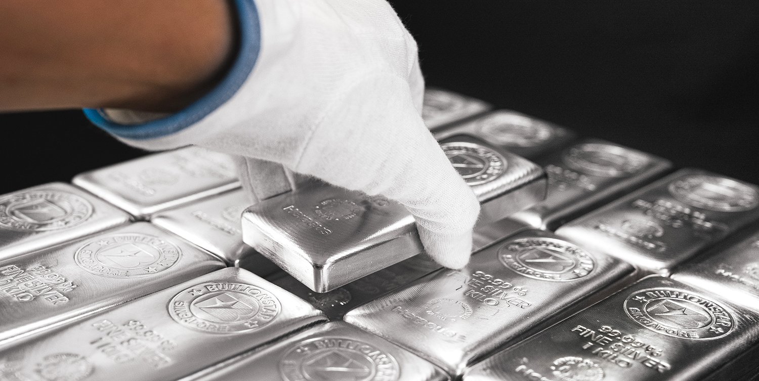 Glossed hand picks up silver